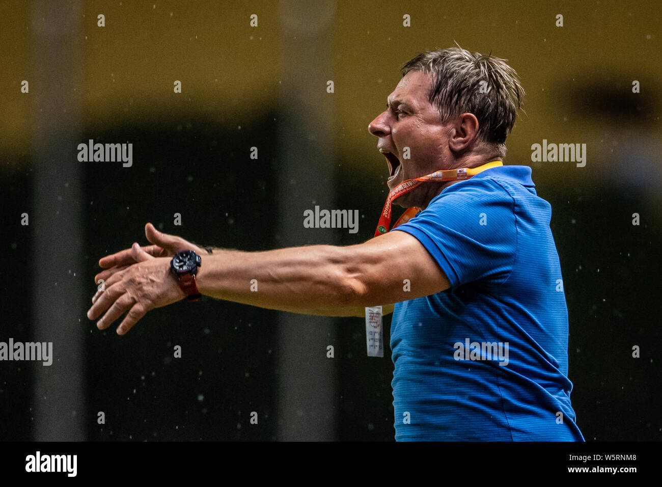 Head coach Dragan Stojkovic of Guangzhou R&F shouts instructions to his players as they compete against Hebei China Fortune in their 12th round match Stock Photo