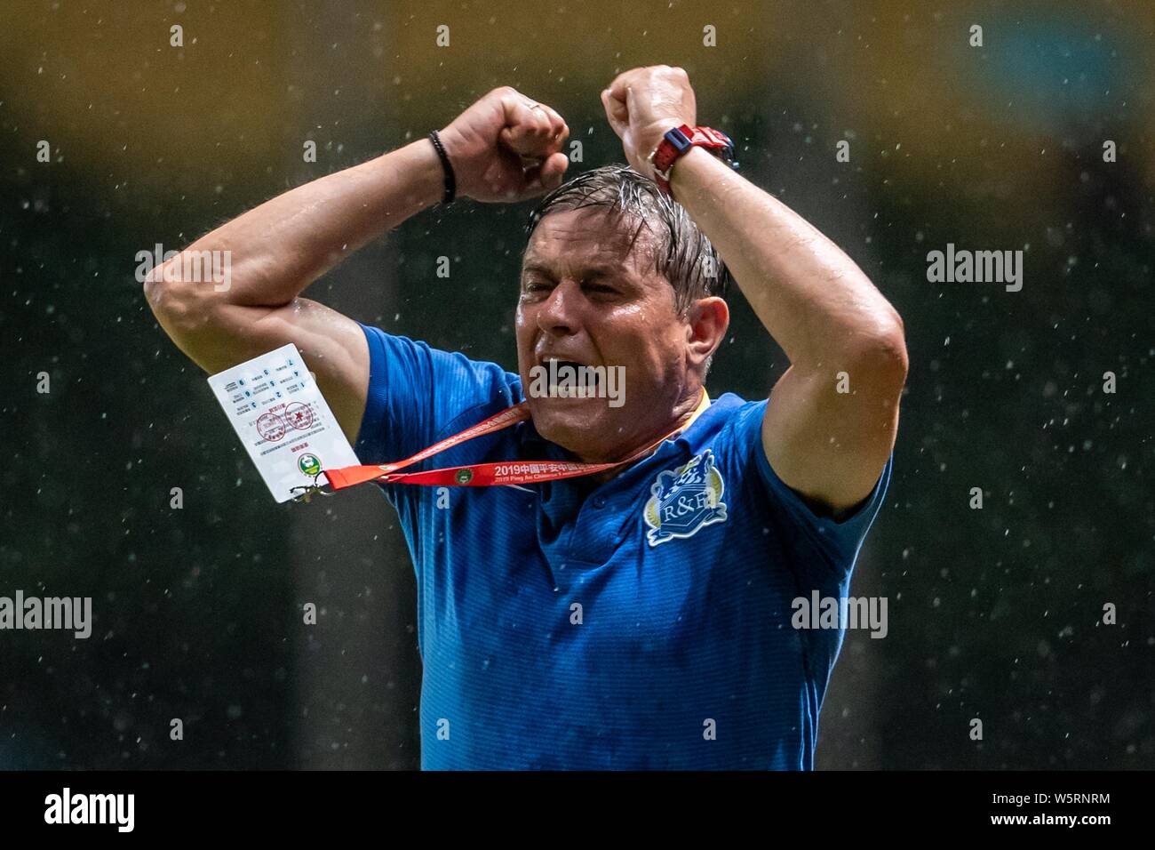Head coach Dragan Stojkovic of Guangzhou R&F shouts instructions to his players as they compete against Hebei China Fortune in their 12th round match Stock Photo