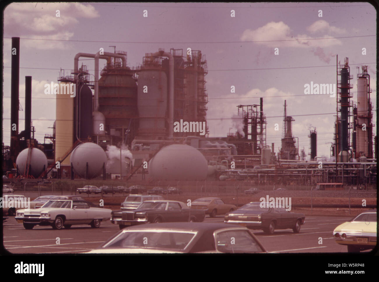 NEW JERSEY TURNPIKE AT LINDEN, WITH EXXON OIL REFINERY IN BACKGROUND Stock Photo