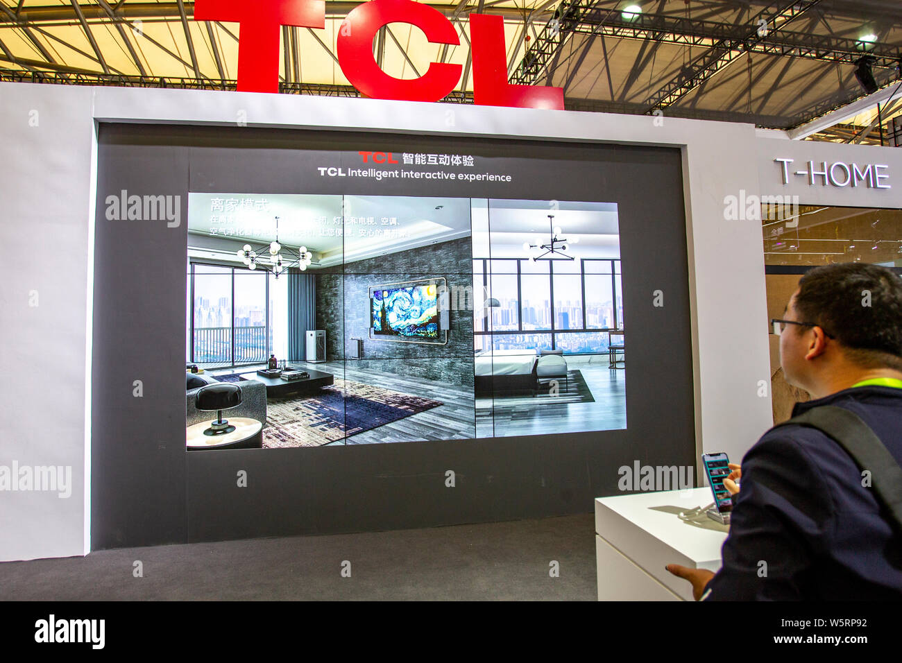 --FILE--People visit the stand of TCL during the Appliance & Electronics World Expo 2019 (AWE 2019) in Shanghai, China, 16 March 2019.   TCL Corp, a C Stock Photo