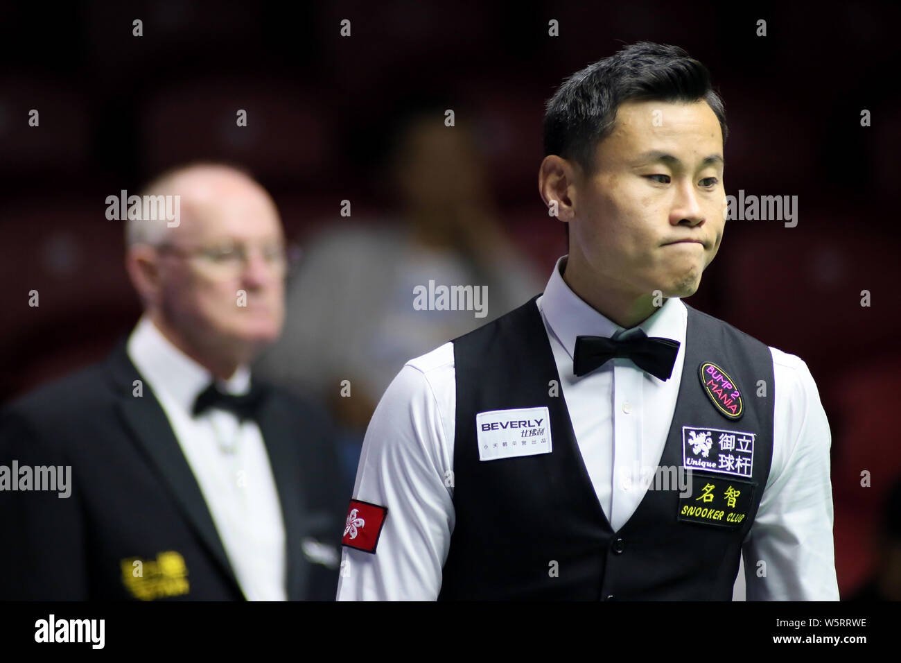 Andy Lee of Hong Kong considers a shot to Northern Ireland in the Group B match during the Beverly 2019 Snooker World Cup in Wuxi city, east Chinas J Stock Photo