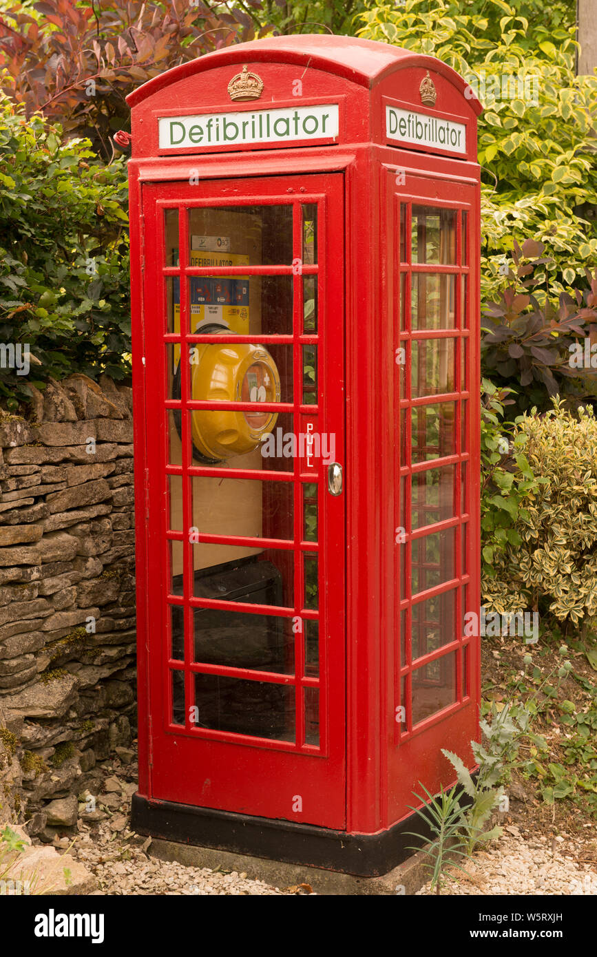 K6 telephone box used to house a defribrillator in Compton Abdale, Gloucestershire, England Stock Photo