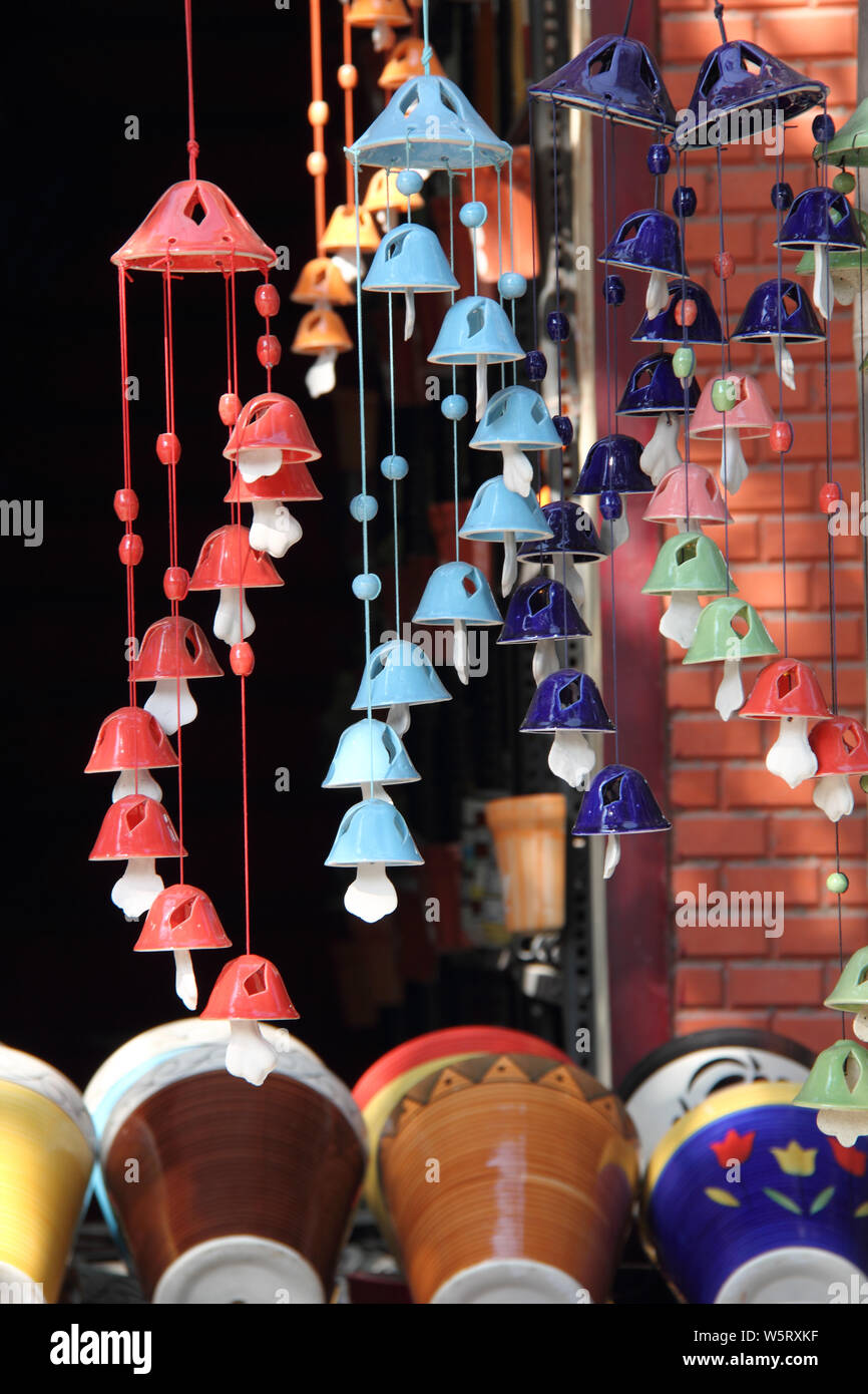 Wind chimes hanging at a market stall Stock Photo