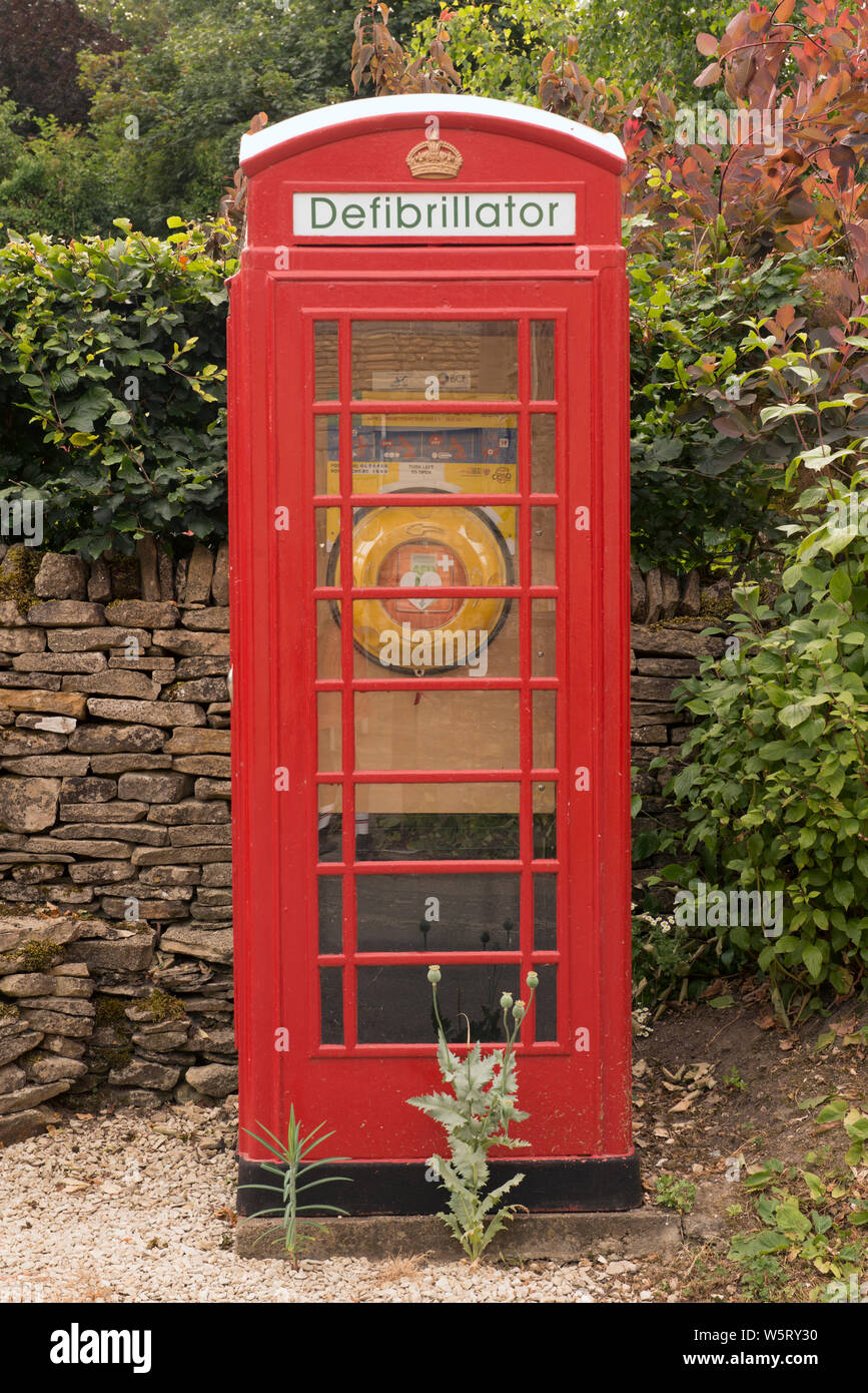 K6 telephone box used to house a defribrillator in Compton Abdale, Gloucestershire, England Stock Photo