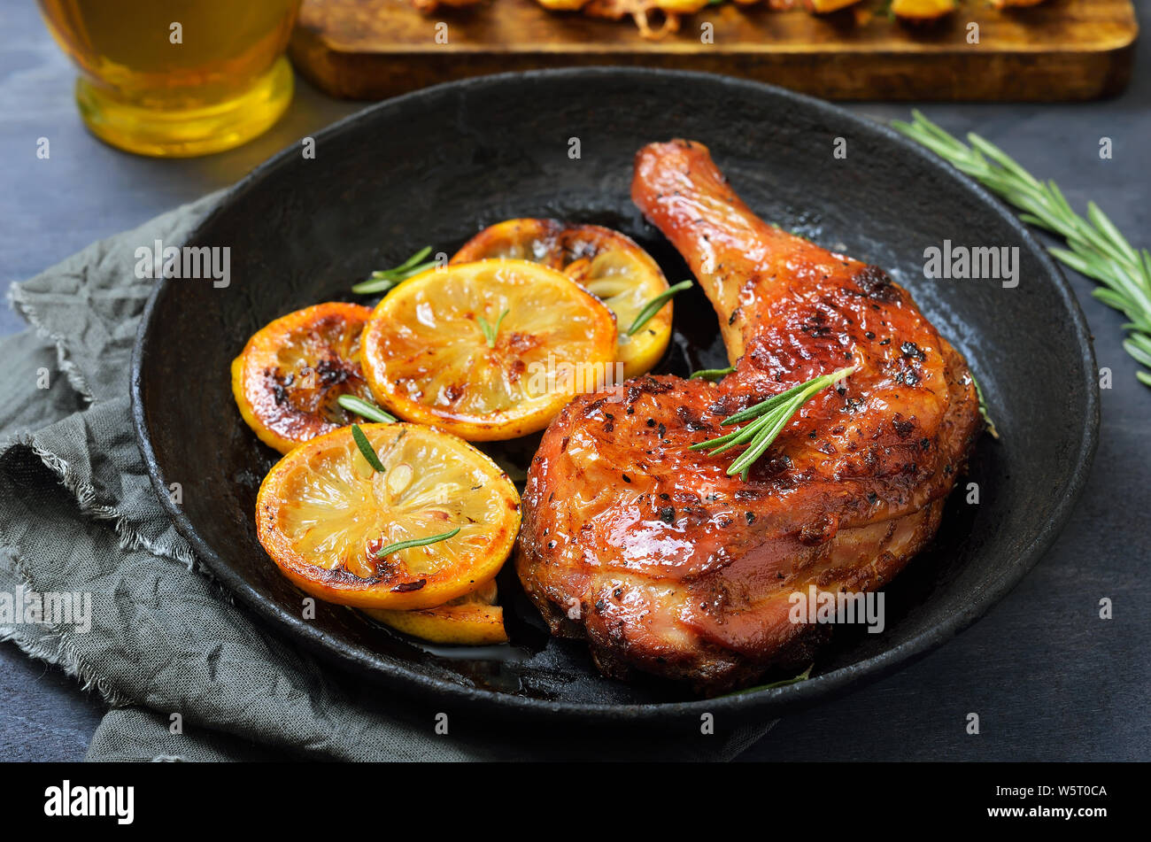 Grilled chicken leg and vegetables in frying pan Stock Photo Alamy