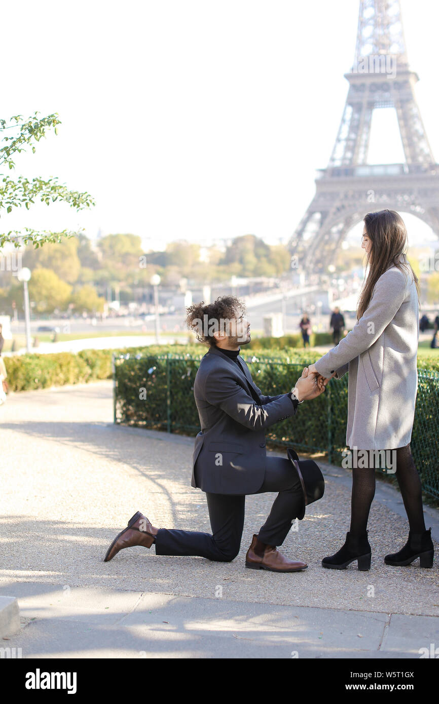 Afro American Boy Making Proposal To Caucasian Girlfriend In Paris Eiffel Tower In Background Concept Of Love And International Couple Stock Photo Alamy