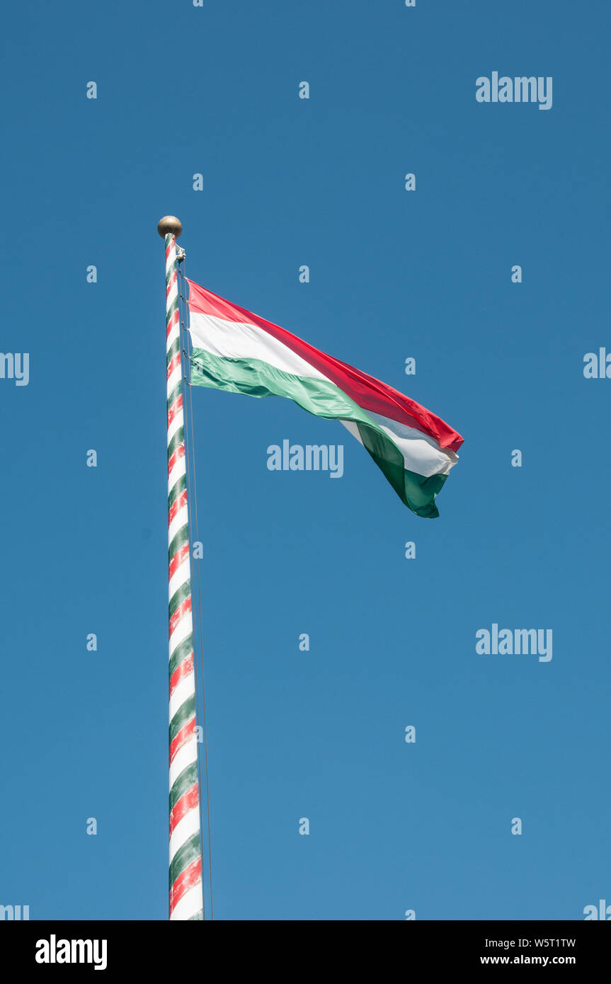 Around Budapest- National Flag flying in a gentle breeze. Stock Photo
