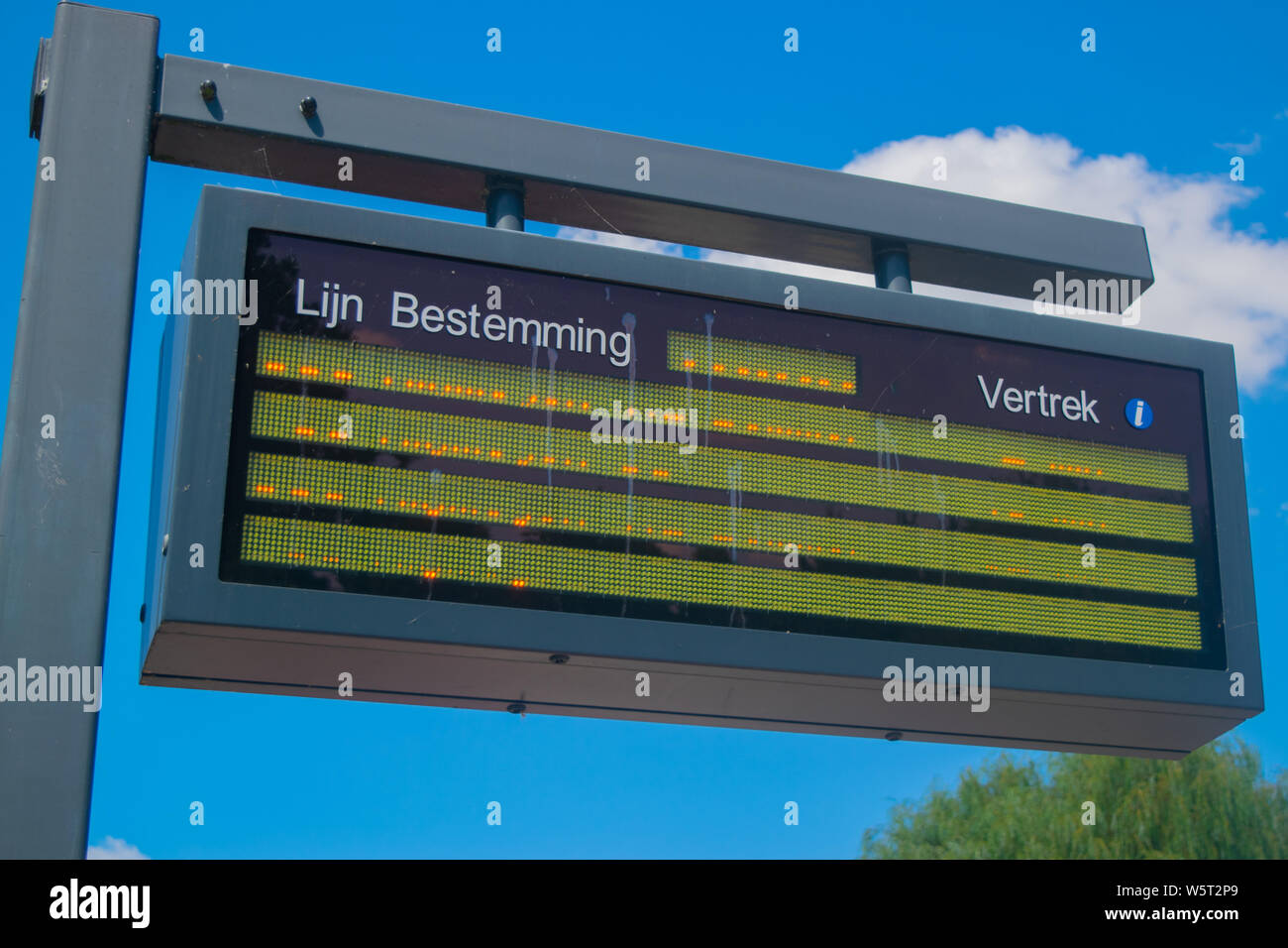Information panel with Dutch bus departure times,electronic bulletin