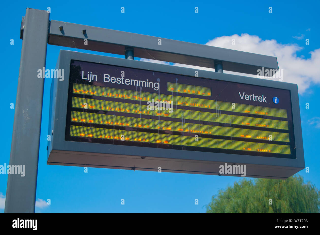 Information panel with Dutch bus departure times,electronic bulletin
