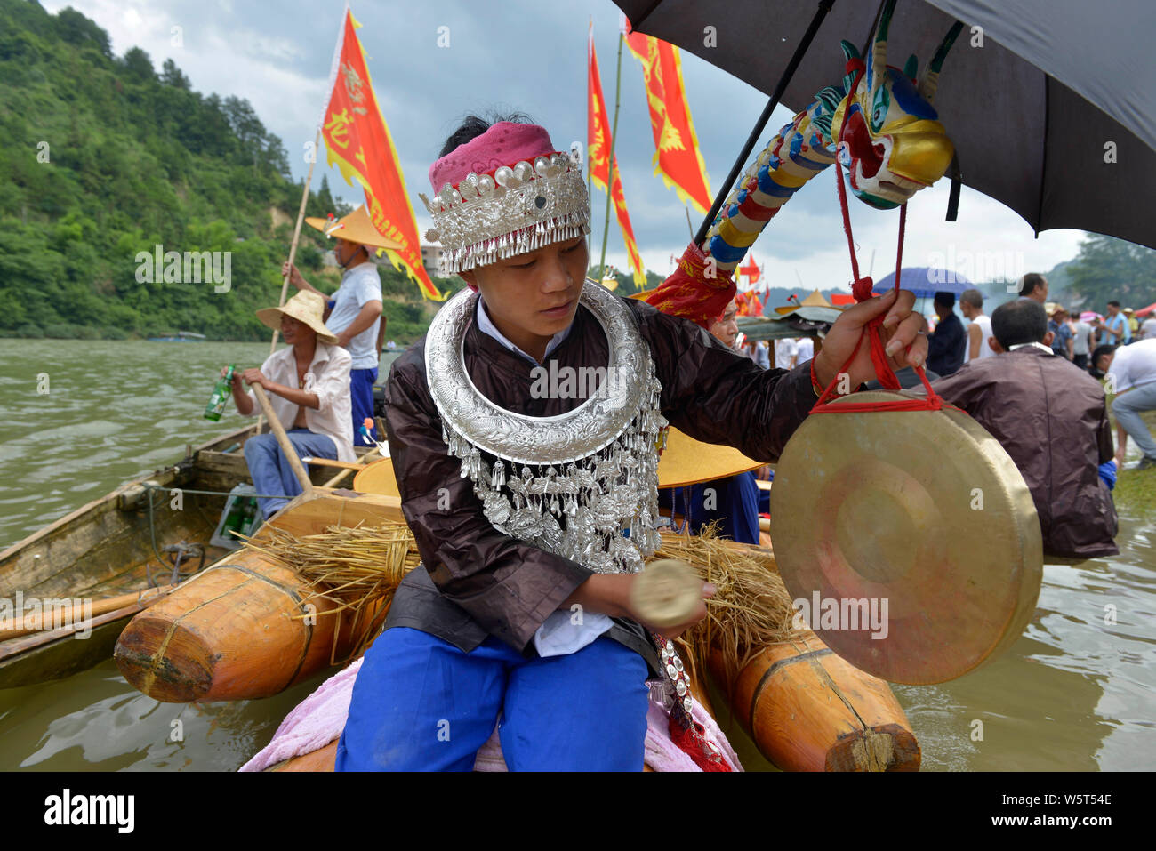 Chinese people of Miao ethnic minority take part in a dragon race
