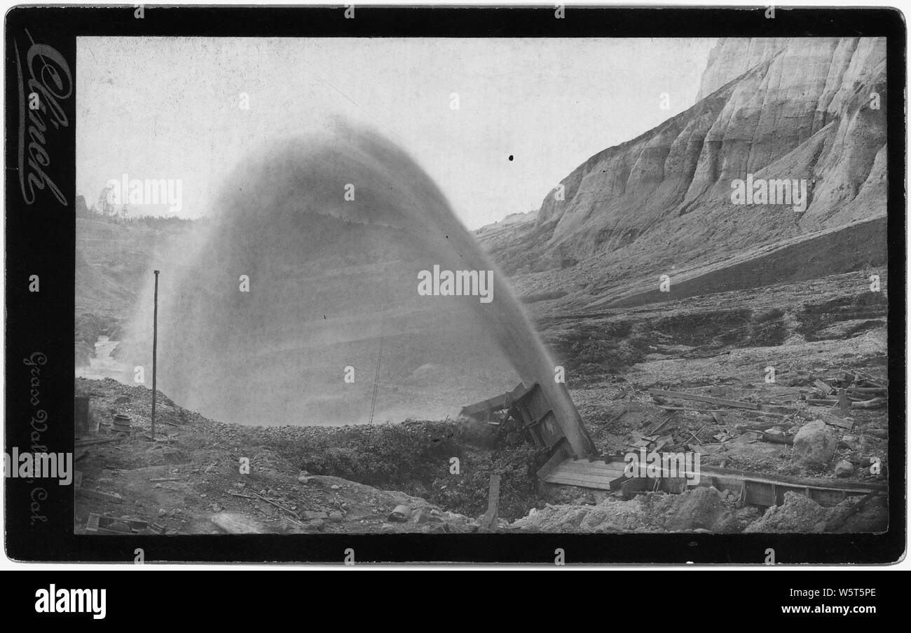 Operating hydraulic mining elevator and impounding works at North Bloomfield Mine, entered as respondent's exhibit 43, in the matter of Equity Case 7865, United States v. North Bloomfield Gravel Mining Company. This elevator raises the water used in mining and the sand, gravel, and other debris from 40 to 150 feet in height, and deposits it in vast impounding reservoirs, more than 300 feet in depth. Stock Photo