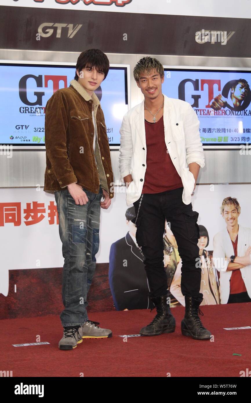 **TAIWAN OUT**Japanese singer Ryohei Kurosawa, right, better known by the stage name Akira, of Japanese band EXILE, and actor Yu Shirota attend a pres Stock Photo