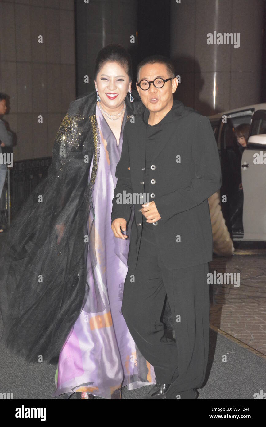 Chinese martial actor Jet Li, also known as Li Lianjie, right, and wife