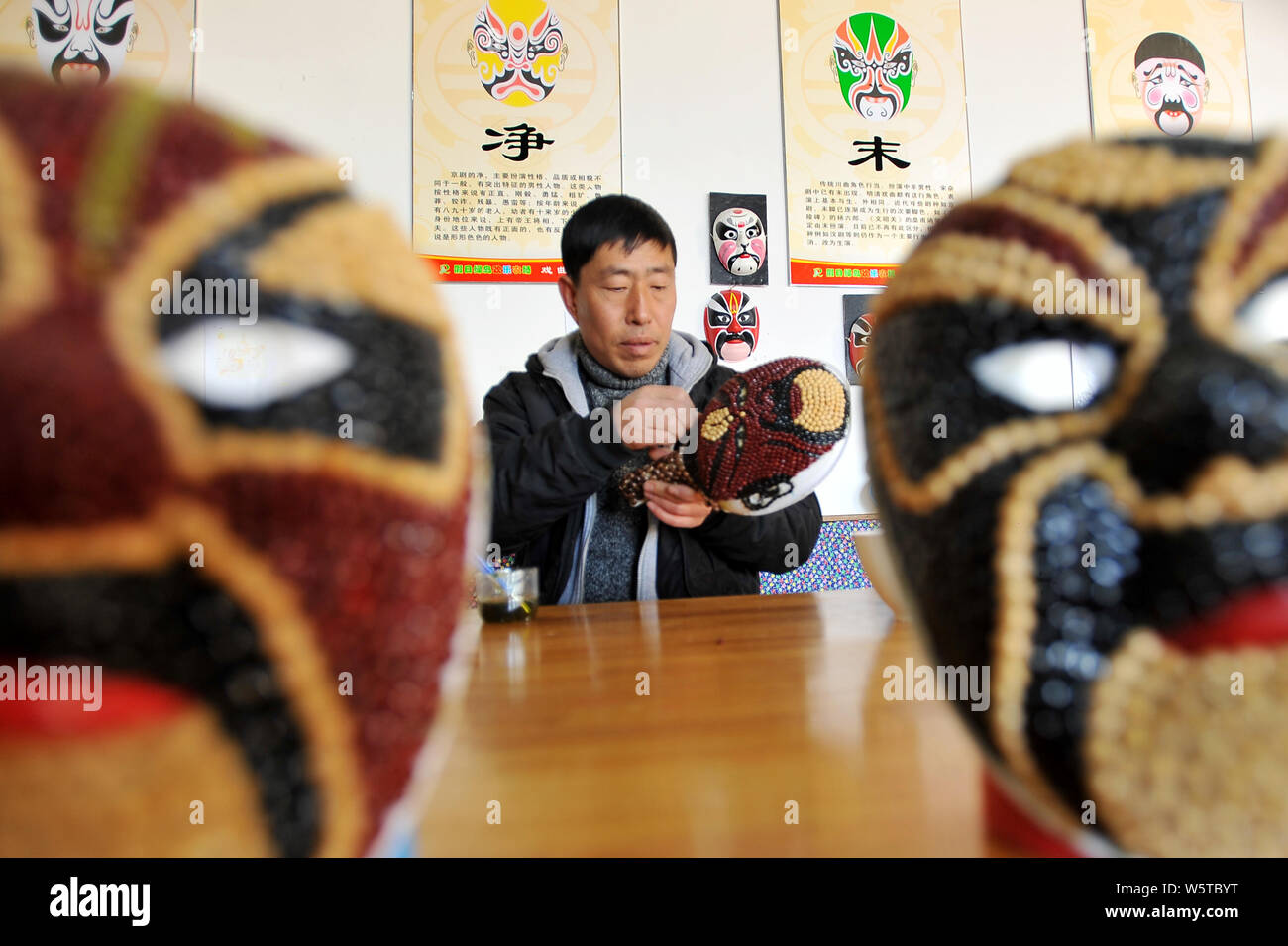 Chinese farmer Sun Xiaodong uses beans and cereals to make a Peking ...