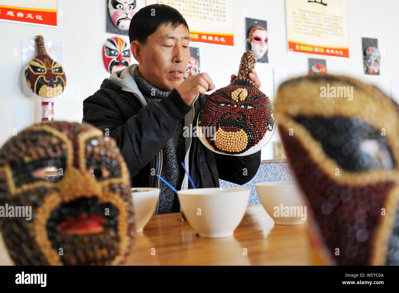 Chinese farmer Sun Xiaodong uses beans and cereals to make a Peking ...