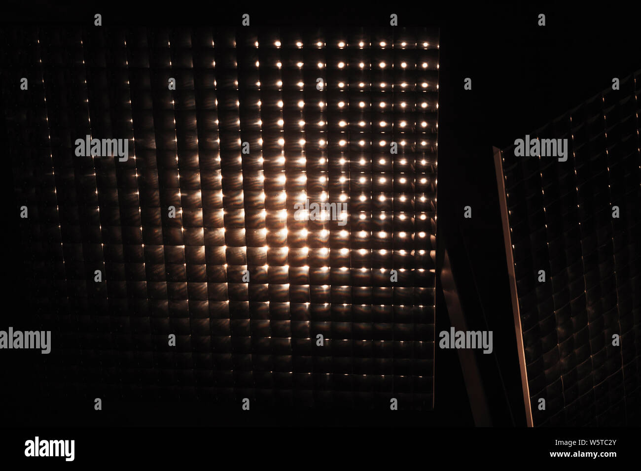 Square cellular lamp reflector, modern illumination system. Abstract background photo Stock Photo