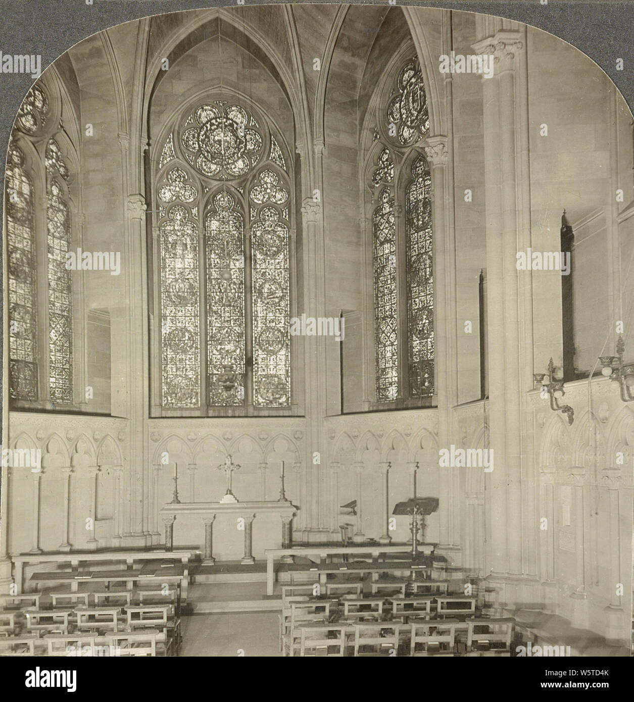 St. Martin's Chapel, Cathedral of St. John the Divine, New York, in 1920s. The Cathedral of Saint John the Divine is the cathedral of the Episcopal Diocese of New York. It is located in New York City at 1047 Amsterdam Avenue between West 110th Street and 113th Street in Manhattan's Morningside Heights neighborhood. Designed in 1888 and begun in 1892, the cathedral has undergone radical stylistic changes and interruption of construction by the two World Wars. Stock Photo