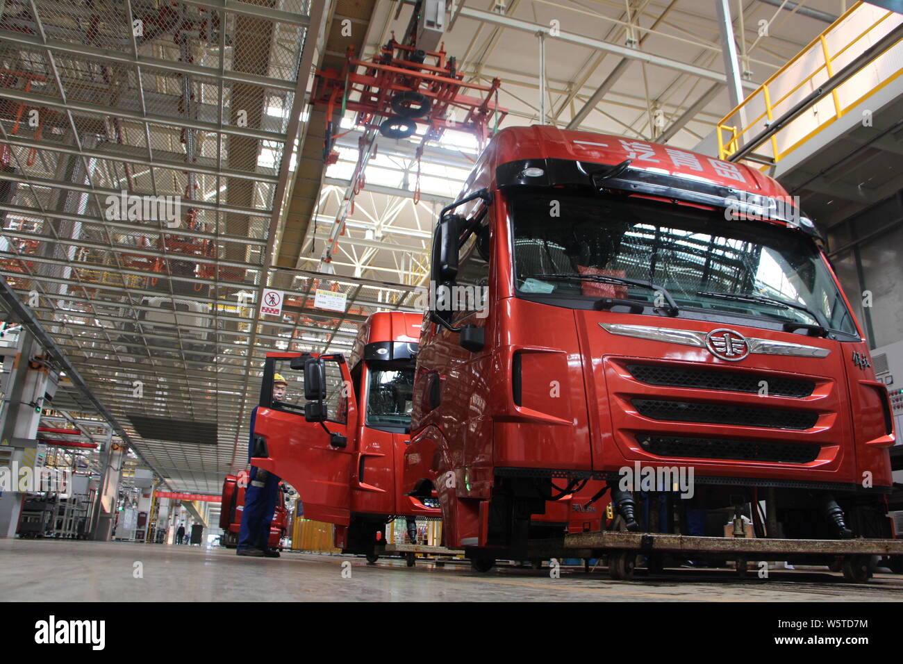 --FILE--Chinese workers assemble trucks on the assembly line at an auto ...