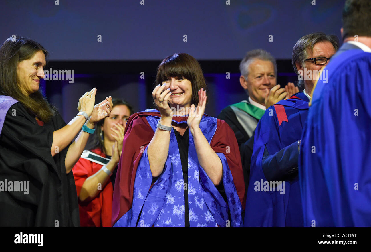 Brighton UK 30th July 2019 - Dr Jessica Moriarty applauding ,  she is the lecturer mentioned by famous transgender model Munroe Bergdorf who recieved  an honorary doctor of letters at the University of Brighton graduation ceremony  . Credit : Simon Dack / Alamy Live News Stock Photo