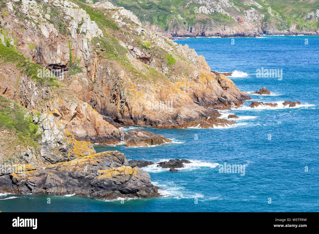 The view NE from the cliffs at Pointe de la Moye, Le Gouffre, Les Villets on the beautiful, rugged south coast of Guernsey, Channel Islands UK Stock Photo