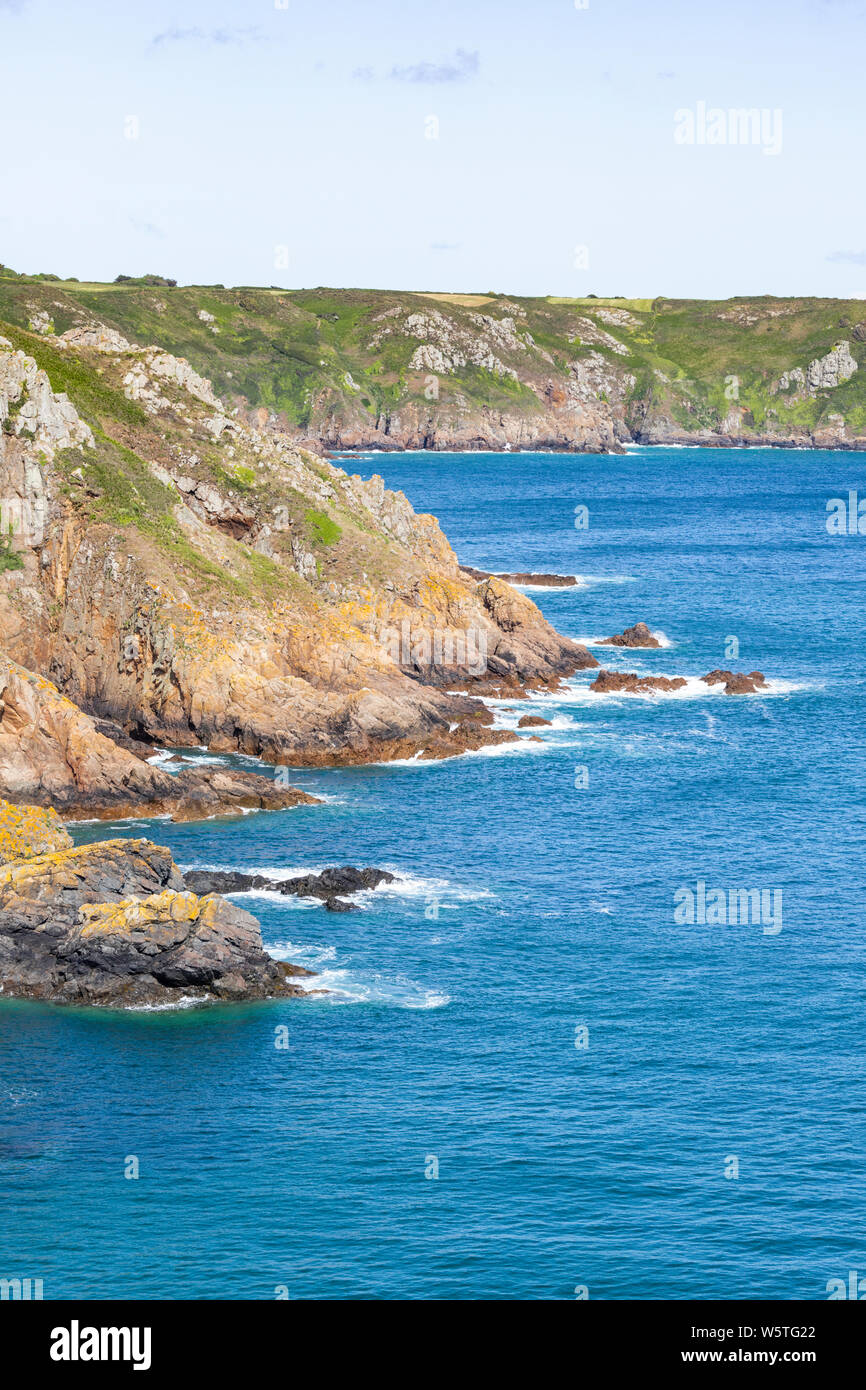 The view NE from the cliffs at Pointe de la Moye, Le Gouffre, Les Villets on the beautiful, rugged south coast of Guernsey, Channel Islands UK Stock Photo