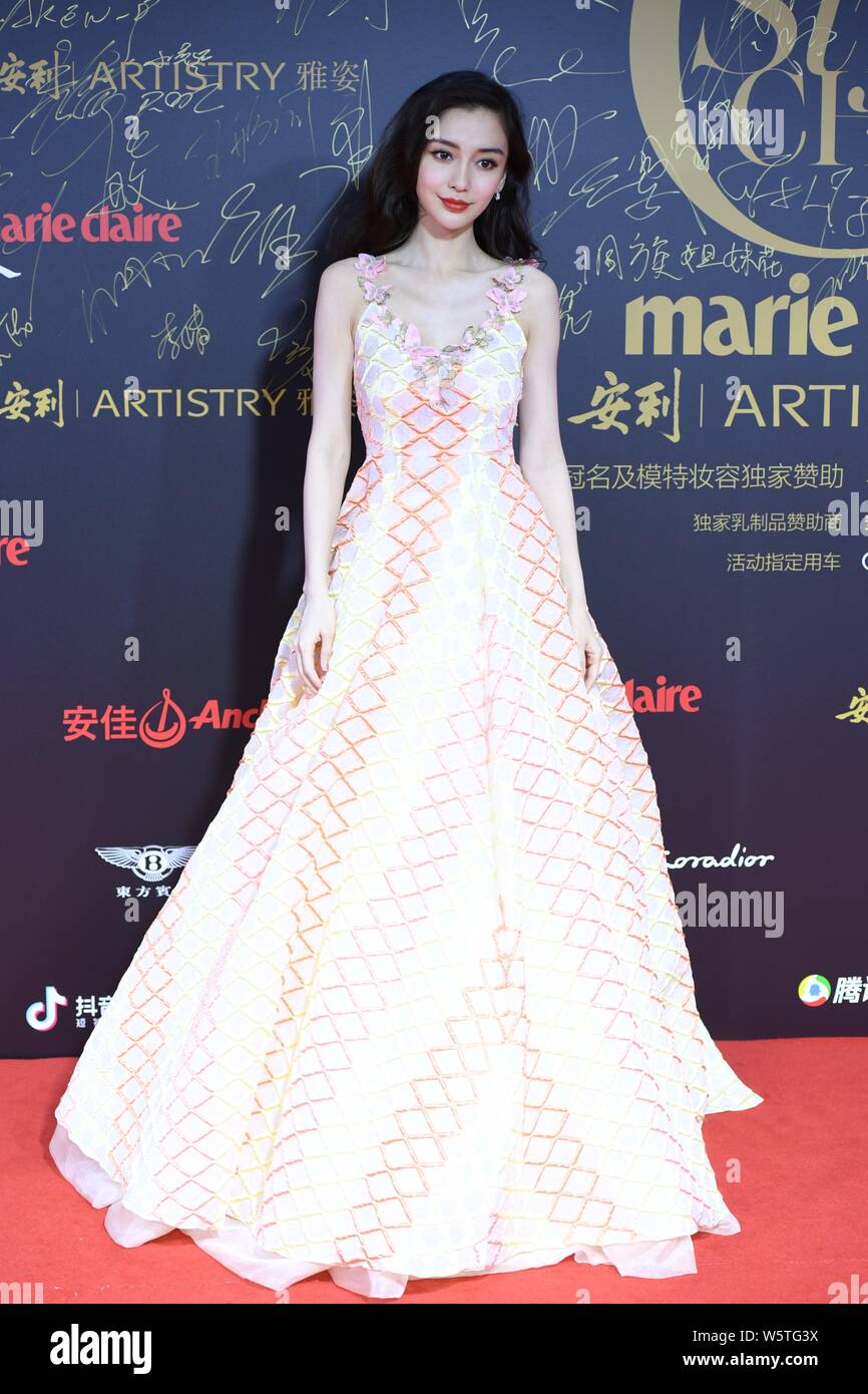 Hong Kong actress Angelababy poses as she arrives on the red carpet for the 2018 Marie Claire Style China Artistry Party in Beijing, China, 17 Decembe Stock Photo