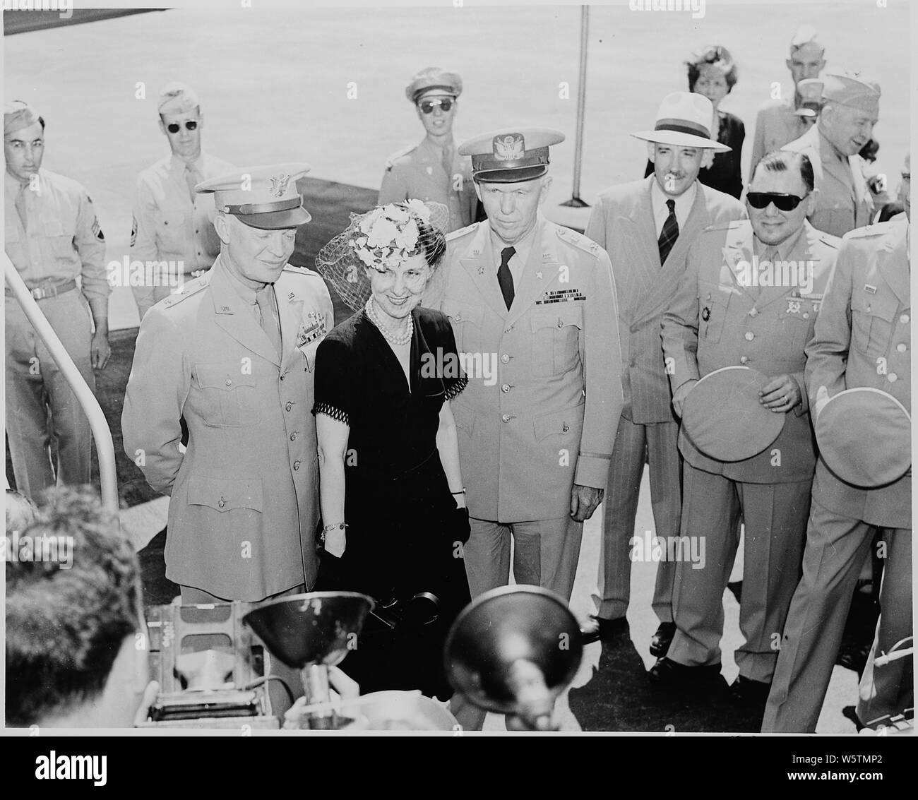 Photograph of General Dwight D. Eisenhower and Mrs. Eisenhower, with the General George C. Marshall and others, at the airport in Washington. Stock Photo