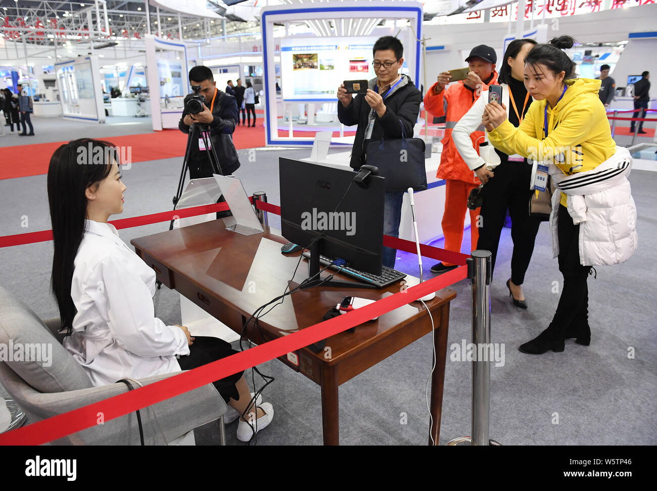 A robot called Yi Jia is on display at a tech exhibition marking 40 ...