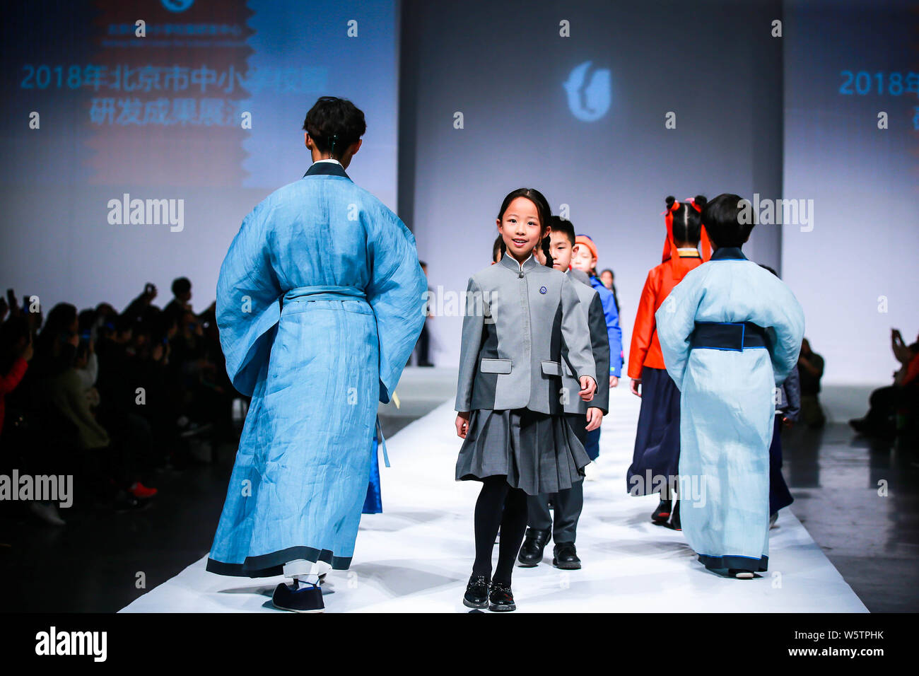 Students present school uniforms at Beijing Institute of Fashion