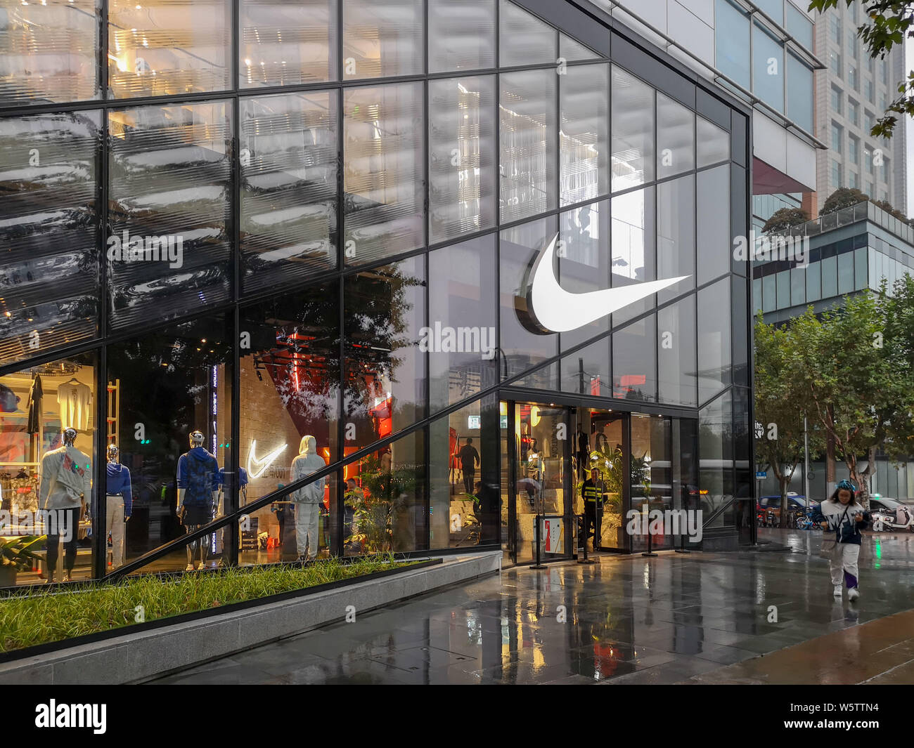 FILE--View of a Nike sportswear store in Shanghai, China, 22 October 2018.  Nike has vowed to remove social barriers and promote women's sneaker cu  Stock Photo - Alamy