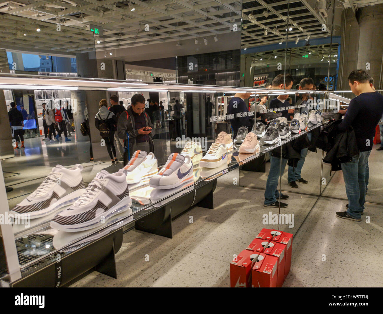FILE--Customers shop at the Nike Shanghai House of Innovation in Shanghai,  China, 22 October 2018. China has become the most rapidly expanding gl  Stock Photo - Alamy