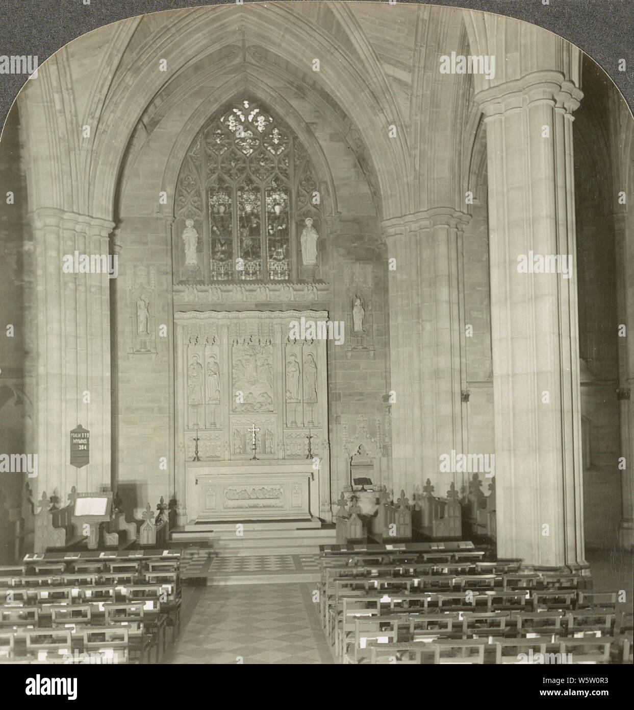 The Chapel of St. James, Cathedral of St. John the Divine, New York in 1920s. The Cathedral of Saint John the Divine is the cathedral of the Episcopal Diocese of New York. It is located in New York City at 1047 Amsterdam Avenue between West 110th Street and 113th Street in Manhattan's Morningside Heights neighborhood. Designed in 1888 and begun in 1892, the cathedral has undergone radical stylistic changes and interruption of construction by the two World Wars. Stock Photo