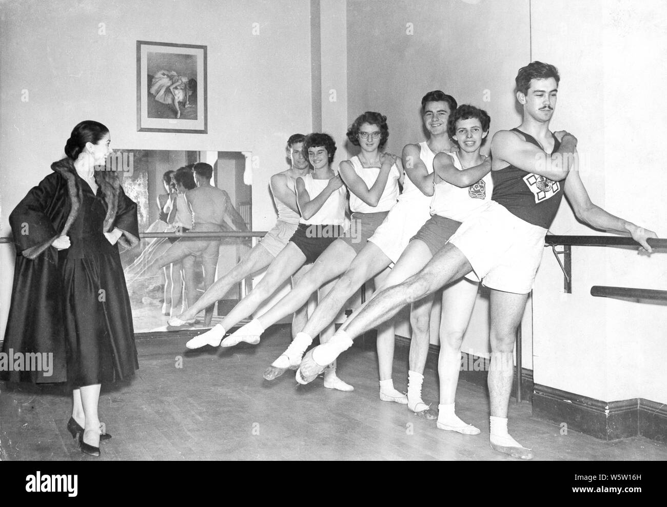 Photo Must Be Credited ©Alpha Press 050000 (1956) Dame Margot Fonteyn, President of the RAD, watches as some of the athletes show her what they have learnt about ballet during the pilot scheme which has been running for 1 month in 1956. L-R: Roy Frampton - a high jumper from Anerley, Jean Adamson - a hurdler from Croydon, Diana Cooper - a high jumper from Twickenham, Sandy Davies - a high jumper from Barnet, Edith Holland - a high jumper from Edgware, Roy Sutton - a hurdler from Horsley, Surrey. Stock Photo