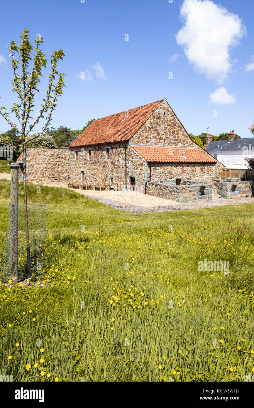 Typical island architecture - Restored 19th century barn and outbuldings at Les Caches Old Farm, Les Villets, Guernsey, Channel Islands UK Stock Photo