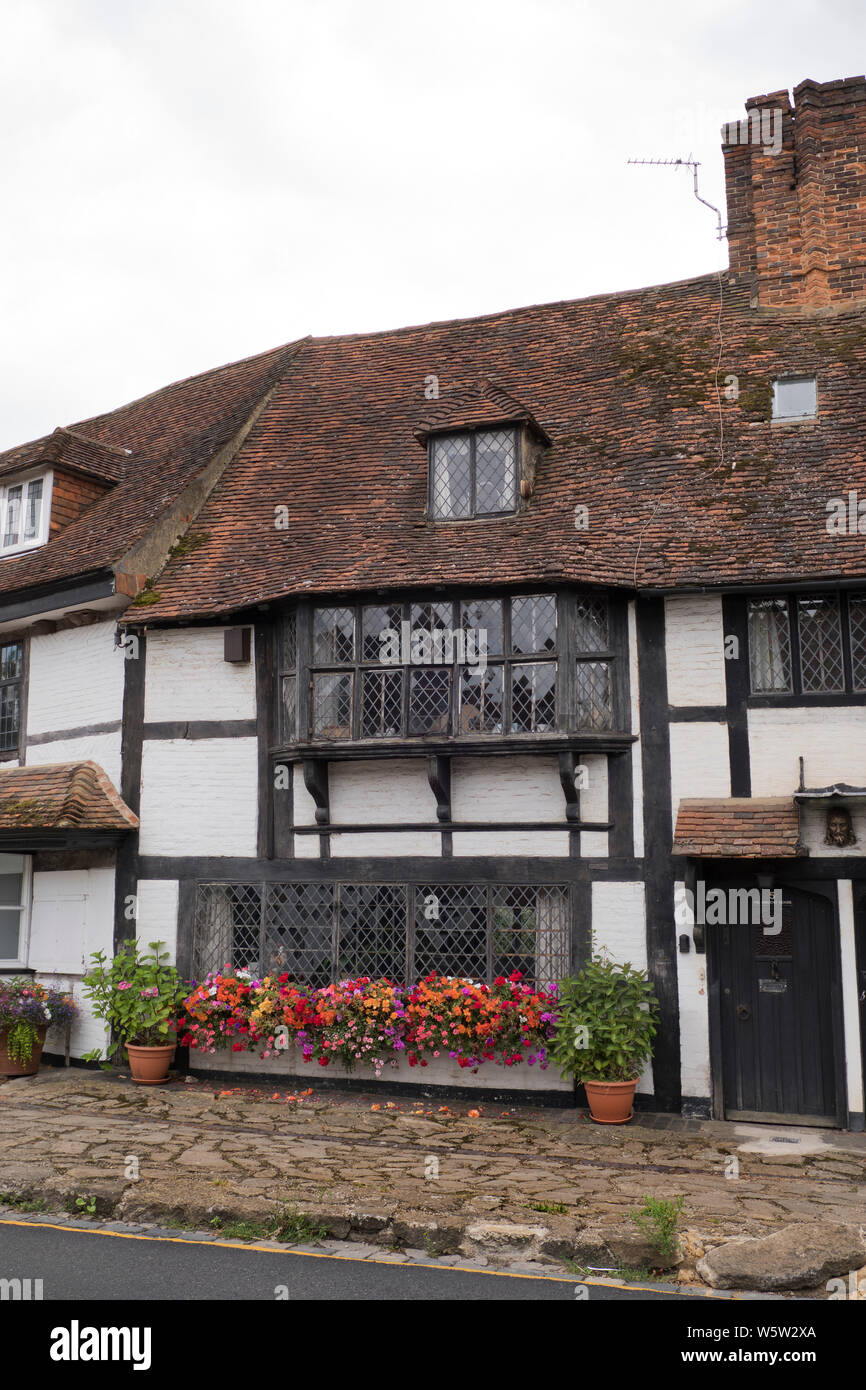 Original 1400s and Tudor buildings and pavement along Biddenden high street in Kent England Stock Photo