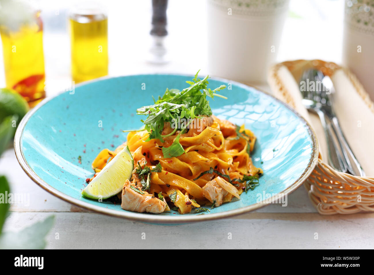 Tagliatelle with grilled salmon in a cream sauce with the addition of white wine Stock Photo Alamy