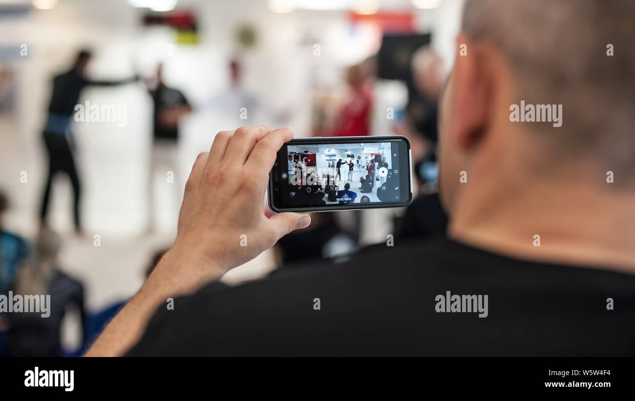 ISTANBUL, TURKEY - Maj 30 - Jun 02. 2019. Student makes video clip with mobile phone with Kapap instructor Avi Nardia on GENERAL MEETING OF KAPAP INST Stock Photo