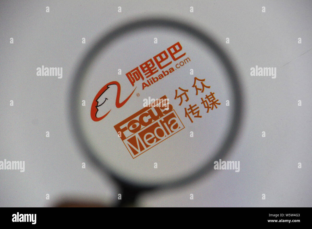 --FILE--A Chinese netizen browses the logos of Alibaba.com and Focus ...