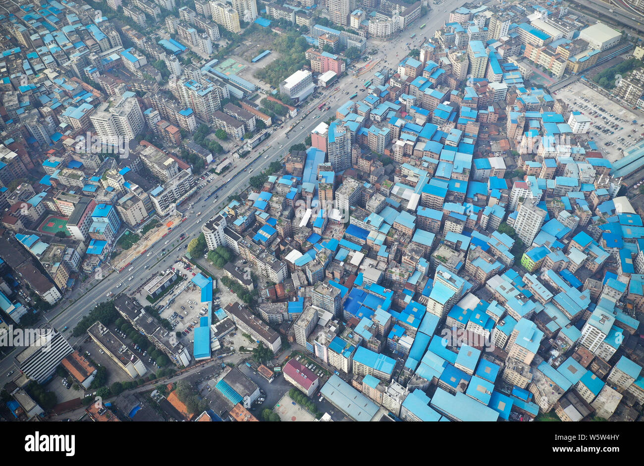 Aerial view of illegallybuilt blue rooftops built by apartment owners