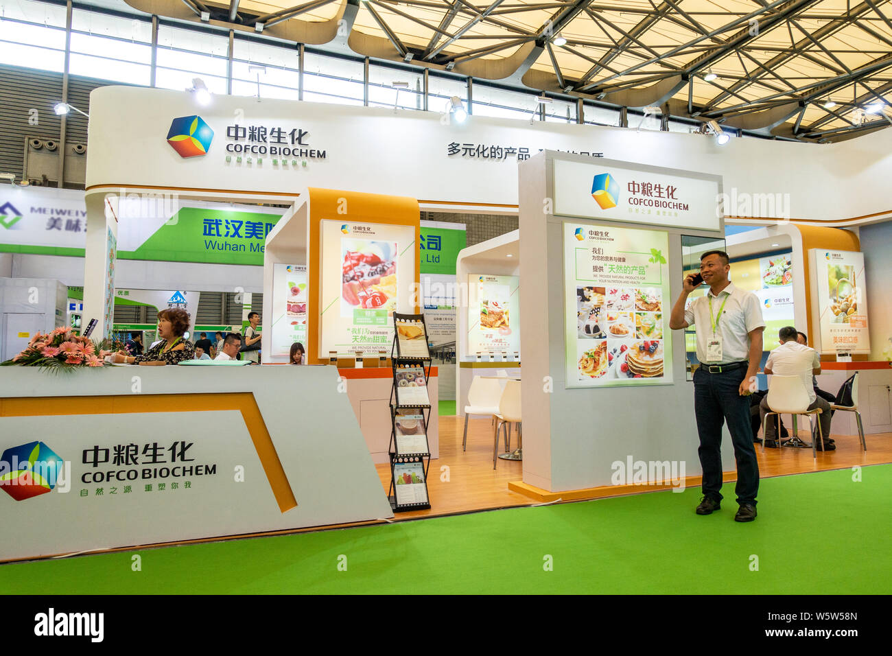 FILEPeople visit the stand of COFCO (China National Cereals, Oils