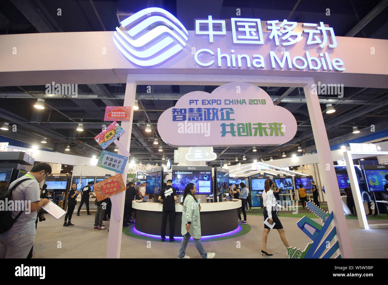 file-people-visit-the-stand-of-china-mobile-during-an-expo-in-beijing-china-26-september
