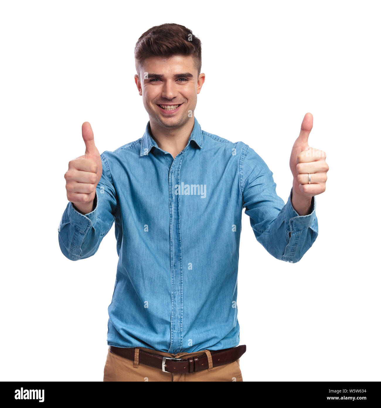happy casual man making the ok thumbs up hand sign on white background ...