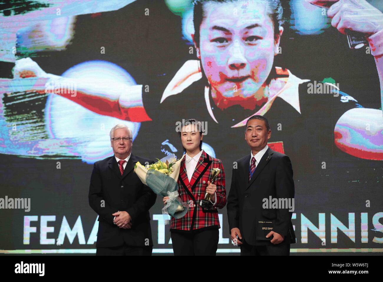 Chinese Table Tennis Player Ding Ning, Center, Poses With Her Trophy ...