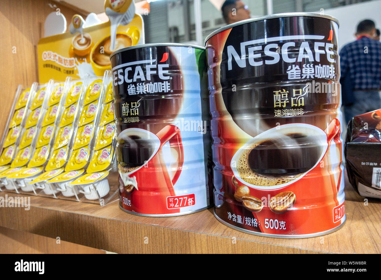 --FILE--Tins of Nescafe coffee of Nestle are displayed during an expo in Shanghai, China, 13 November 2018.   Global food giant Nestle's coffee center Stock Photo