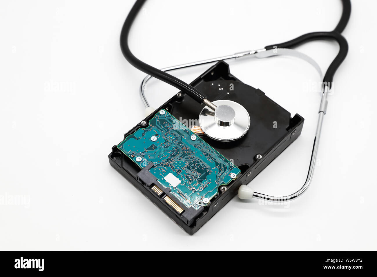 stethoscope with hard disk isolated and white background (this image for technology security checkup concept) Stock Photo