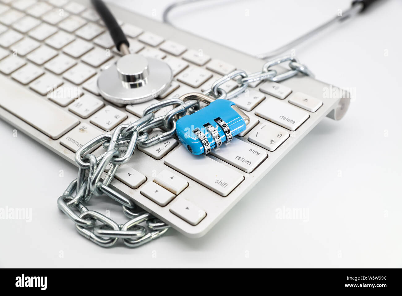 stethoscope with computer keyboard isolated and white background (this image for technology security checkup concept) Stock Photo