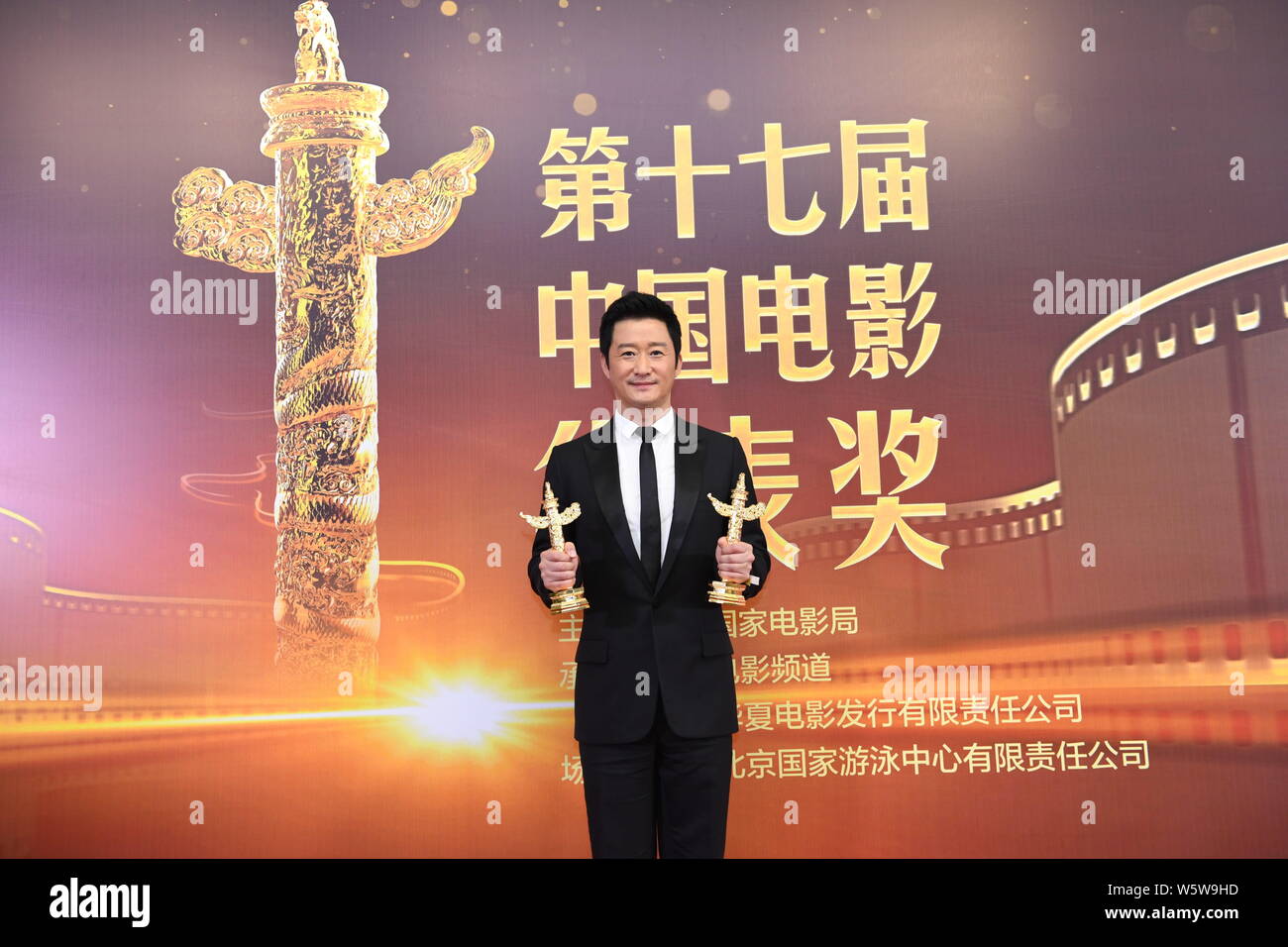 chinese-actor-and-director-wu-jing-poses-with-his-trophy-after-winning