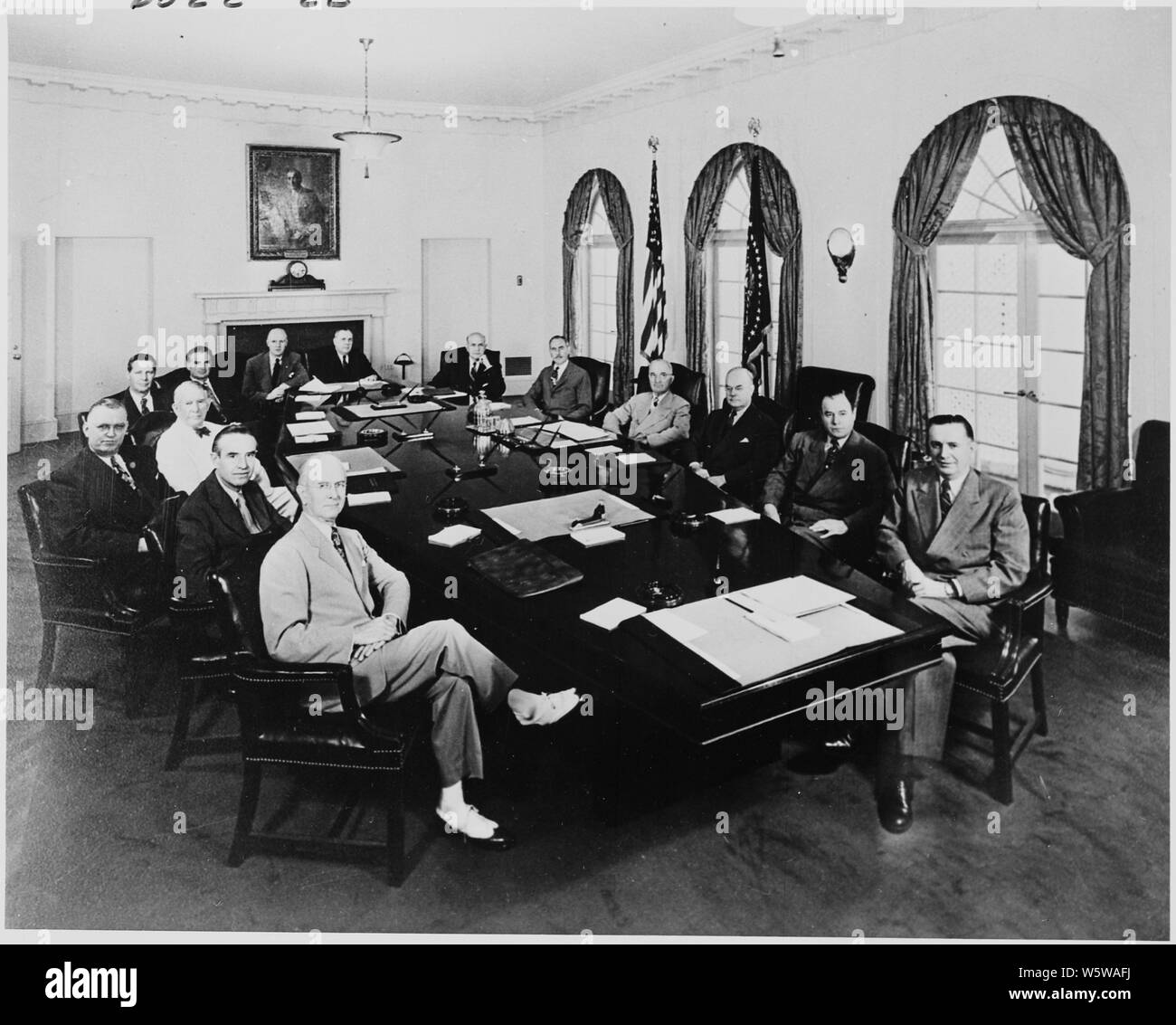Photograph of President Truman with members of his Cabinet and other officials, in the Cabinet Room of the White House: (from left to right around table) Secretary of Commerce Charles Sawyer; Special Assistant to the President Averell Harriman; Assistant to the President John Steelman; Vice President Alben Barkley; Secretary of Labor Maurice Tobin; Chairman Stuart Symington of the National Security Resources Board; Secretary of Agriculture Charles Brannan; Postmaster General Jesse Donaldson; Secretary of Defense Louis Johnson; Secretary of State Dean Acheson; the President; Secretary of the Tr Stock Photo