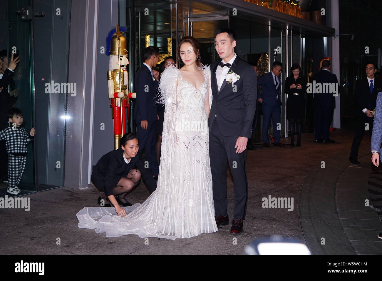 Hong Kong singer and actress Gillian Chung of pop duo Twins and her husband Michael Lai pose for a photo before their wedding ceremony in Hong Kong, C Stock Photo