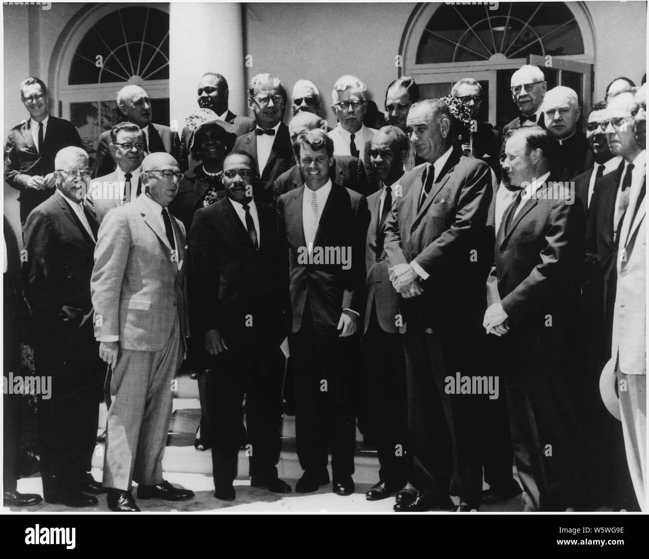 Photograph of White House Meeting with Civil Rights Leaders. June 22, 1963; Scope and content:  Photograph of meeting with Civil Rights leaders. Front Row: Martin Luther King, Jr., Robert F. Kennedy, Roy Wilkins, Lyndon Baines Johnson, Walter P. Reuther, Whitney M. Young, A Philip Randolph Second Row: Second From Left Rosa Gragg Top Row Third From Left James Farmer Stock Photo